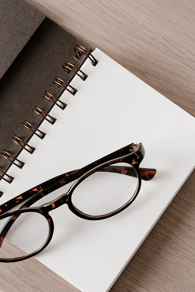 reading-glasses-notebook Pantone cards with neutral, desert-inspired colors