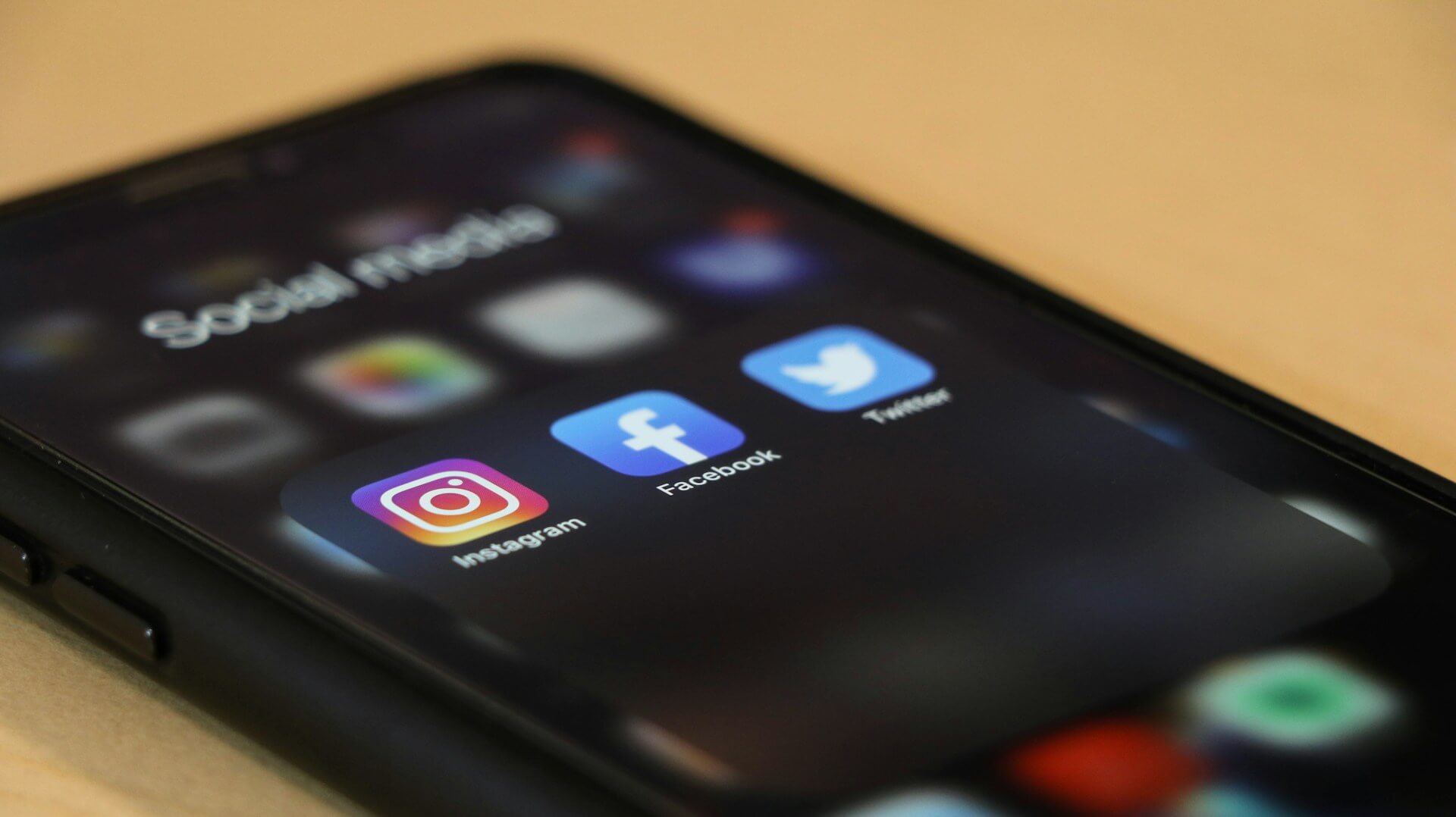 Social media icons on a black phone
